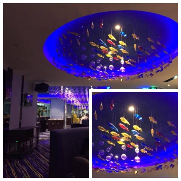 Stranded Fish - iridescent swirls of hand-blown glass fish Hanging sculptures and wall art for a hotel restaurant-1